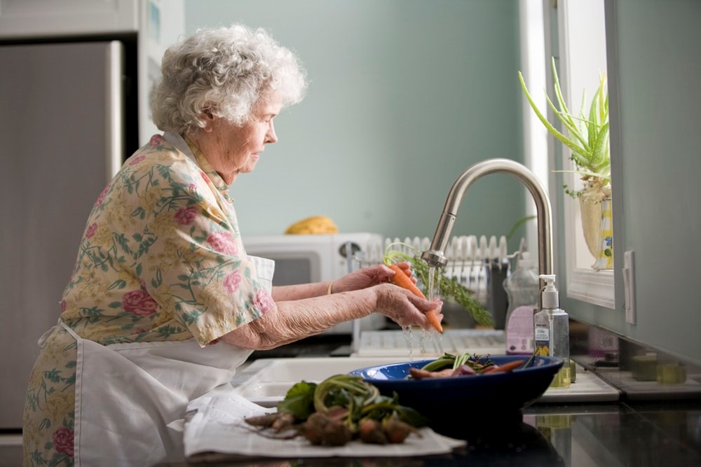 old woman preparing food