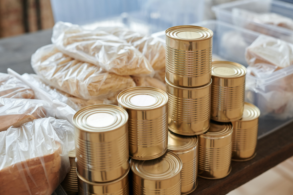 Canned food near wrapped packages