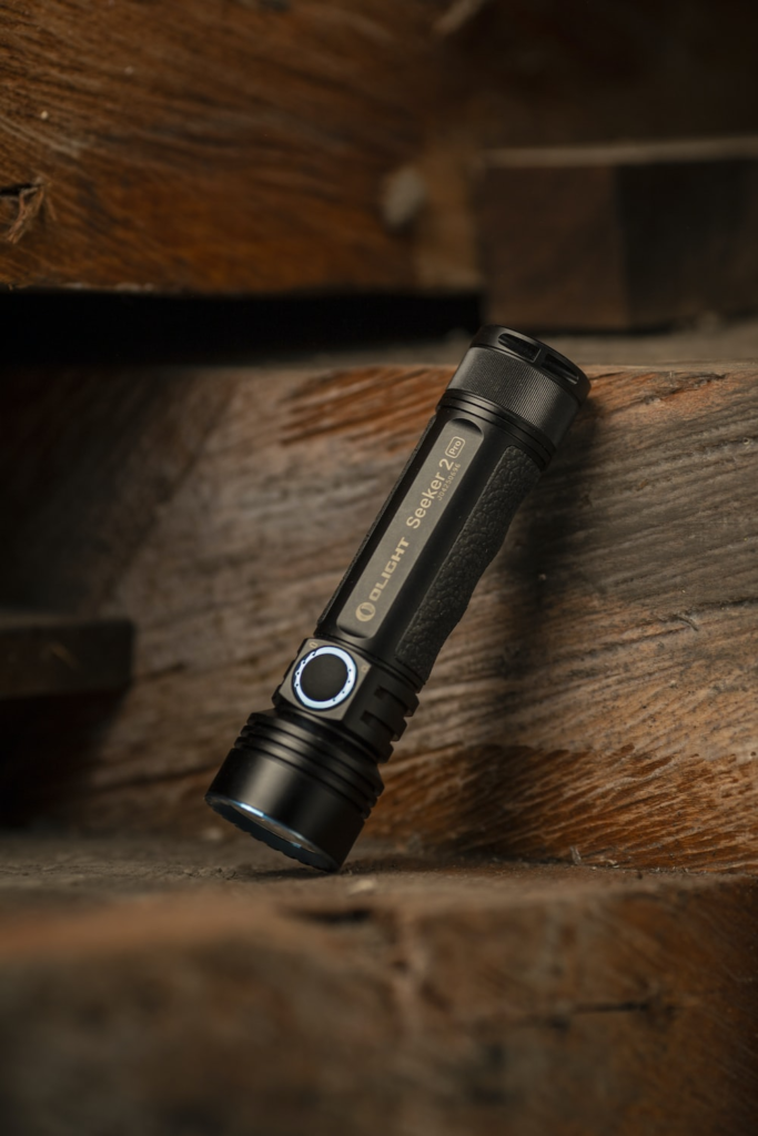 A new flashlight standing on the stairs. 