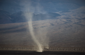 A Tornado developing in a desert.