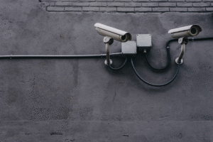 A photo of two surveillance cameras.