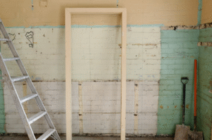 Brown wooden door frame of an older storm shelter
