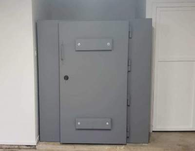 Steel tornado shelter installed inside the house.