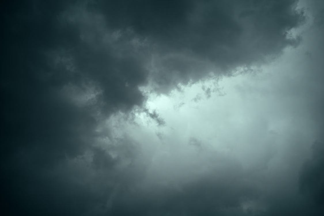 Dark, dramatic storm clouds gathering in the sky.